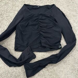 Gymshark Sheer strechy cropped cover up with thumb holes. Super cute!